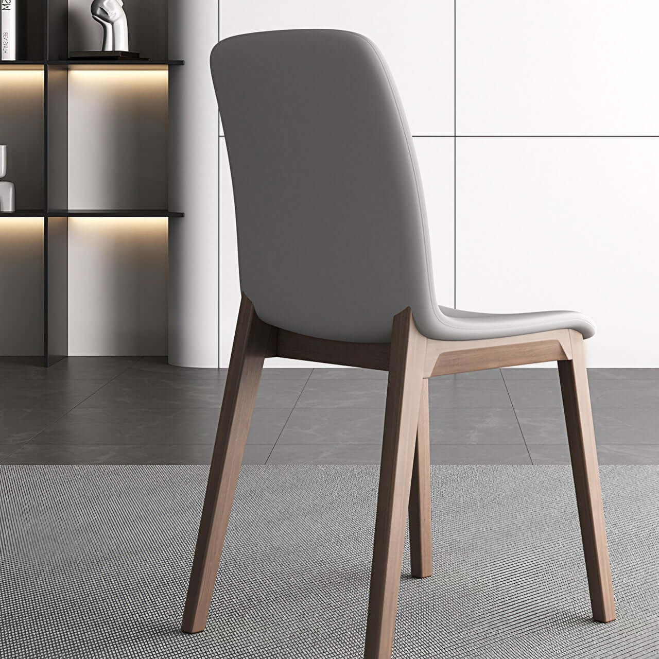 Single modern grey leather dining chair with durable fan-back design and minimalist style