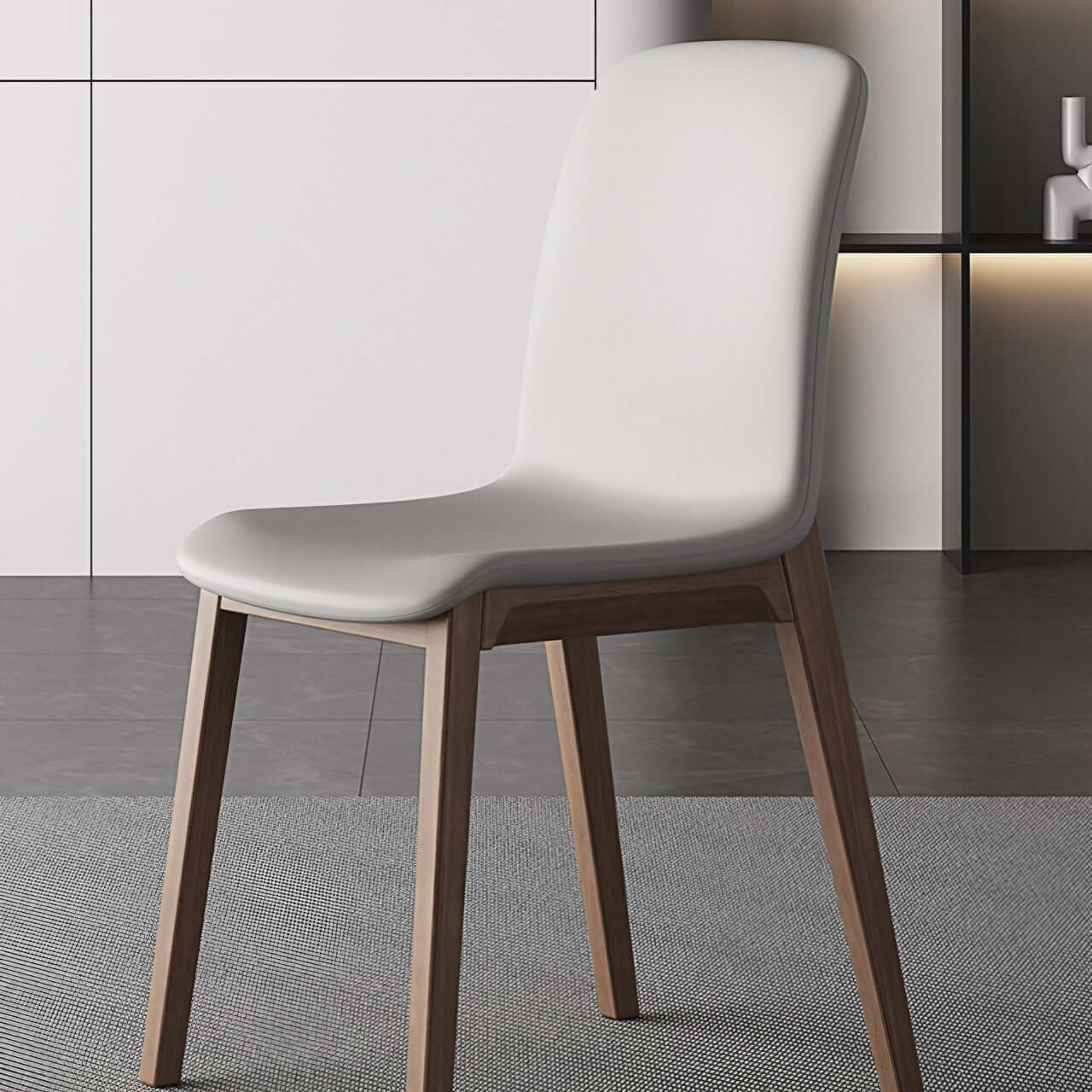Single modern grey leather dining chair with durable fan-back design and minimalist style