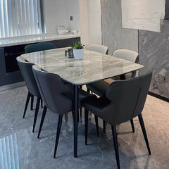 Elegant minimalist dining table with grey rock tabletop and sturdy carbon steel base