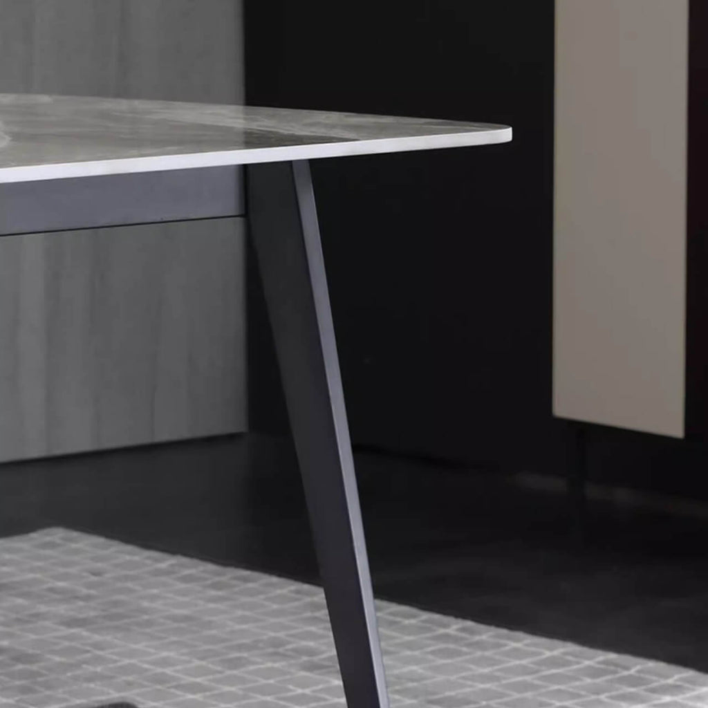 Modern grey rectangular dining table with bright rock tabletop and carbon steel legs
