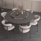 Grey round sintered stone dining table with rotating lazy Susan and simplistic design