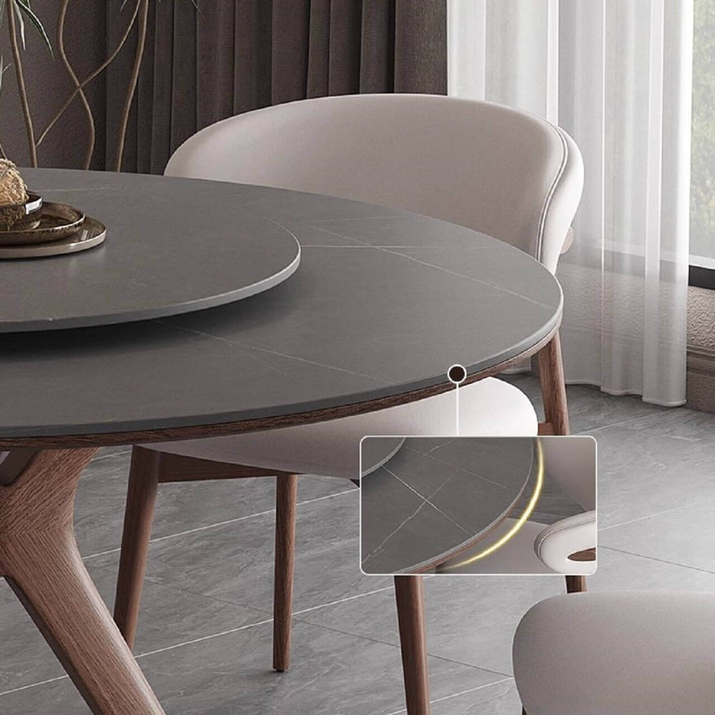 Grey round sintered stone dining table with rotating lazy Susan and simplistic design