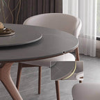 Grey round sintered stone dining table with rotating lazy Susan and simplistic design