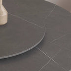 Grey round sintered stone dining table with rotating lazy Susan and simplistic design