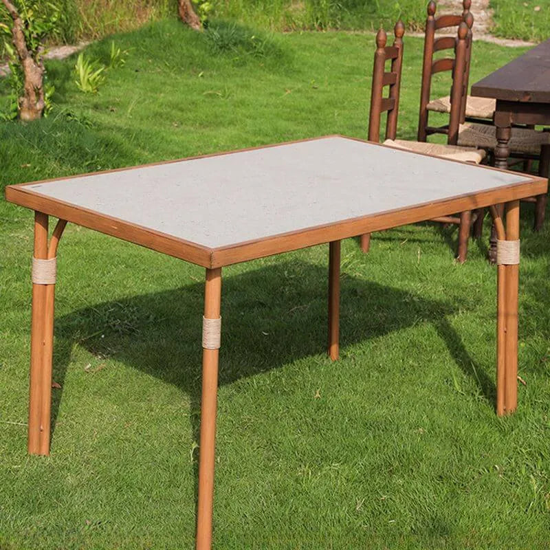 Modern Outdoor Coffee Table with Woven Legs and Matte Grey Top