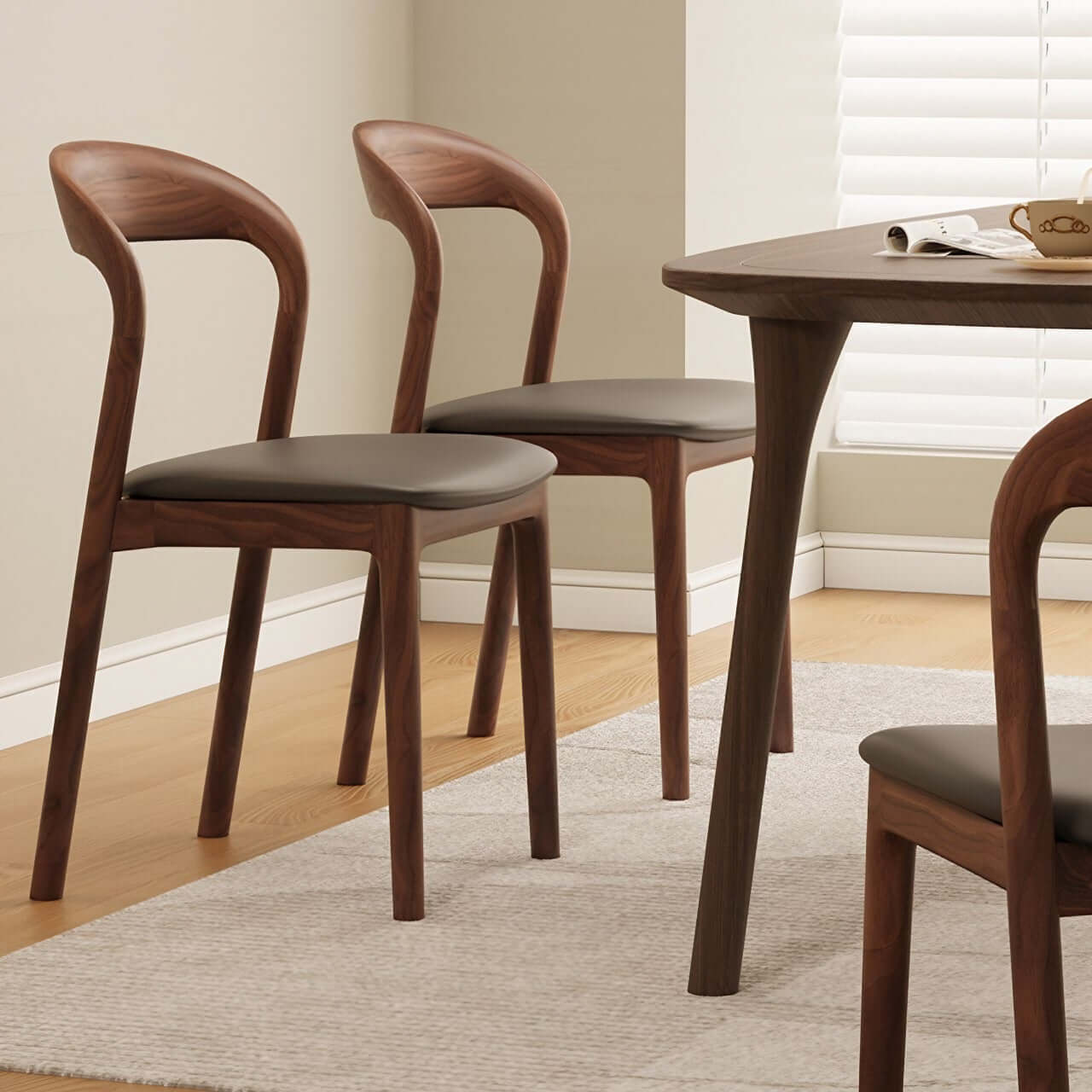 Brown leather dining chair with a modern curved back and simplistic design, single piece main product image メイン画像