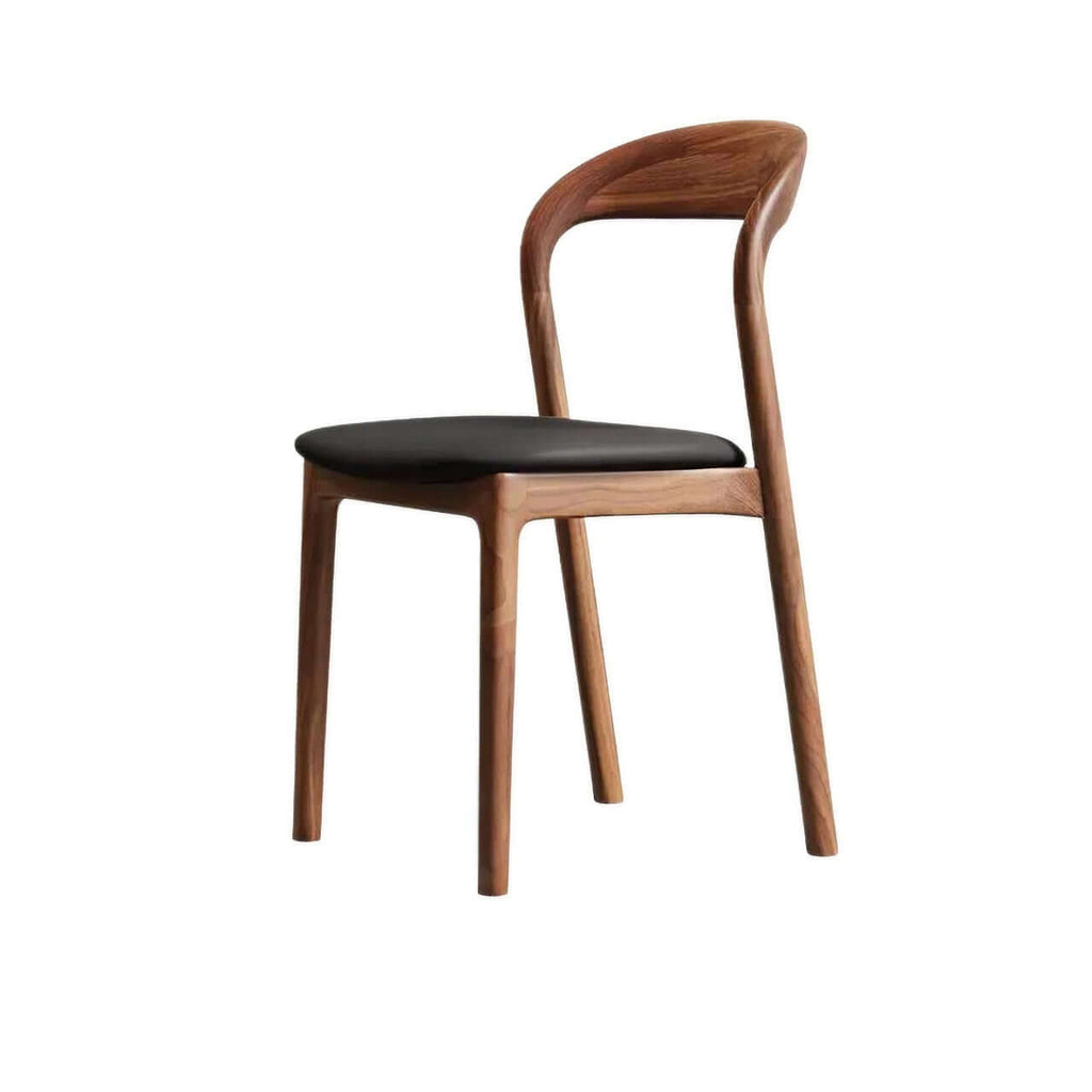 Brown leather dining chair with a modern curved back and simplistic design, single piece