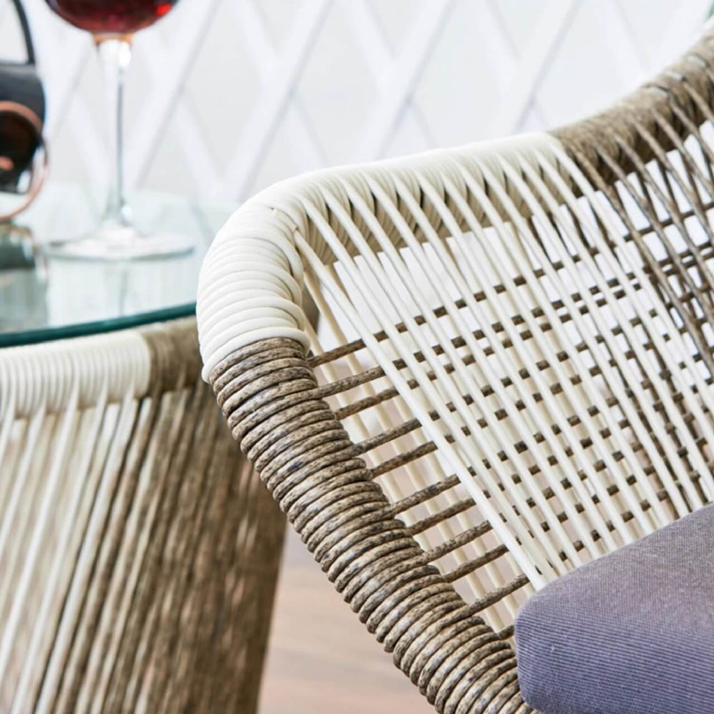 Outdoor PE rattan loveseat with metal legs and cushion pillows for patio seating