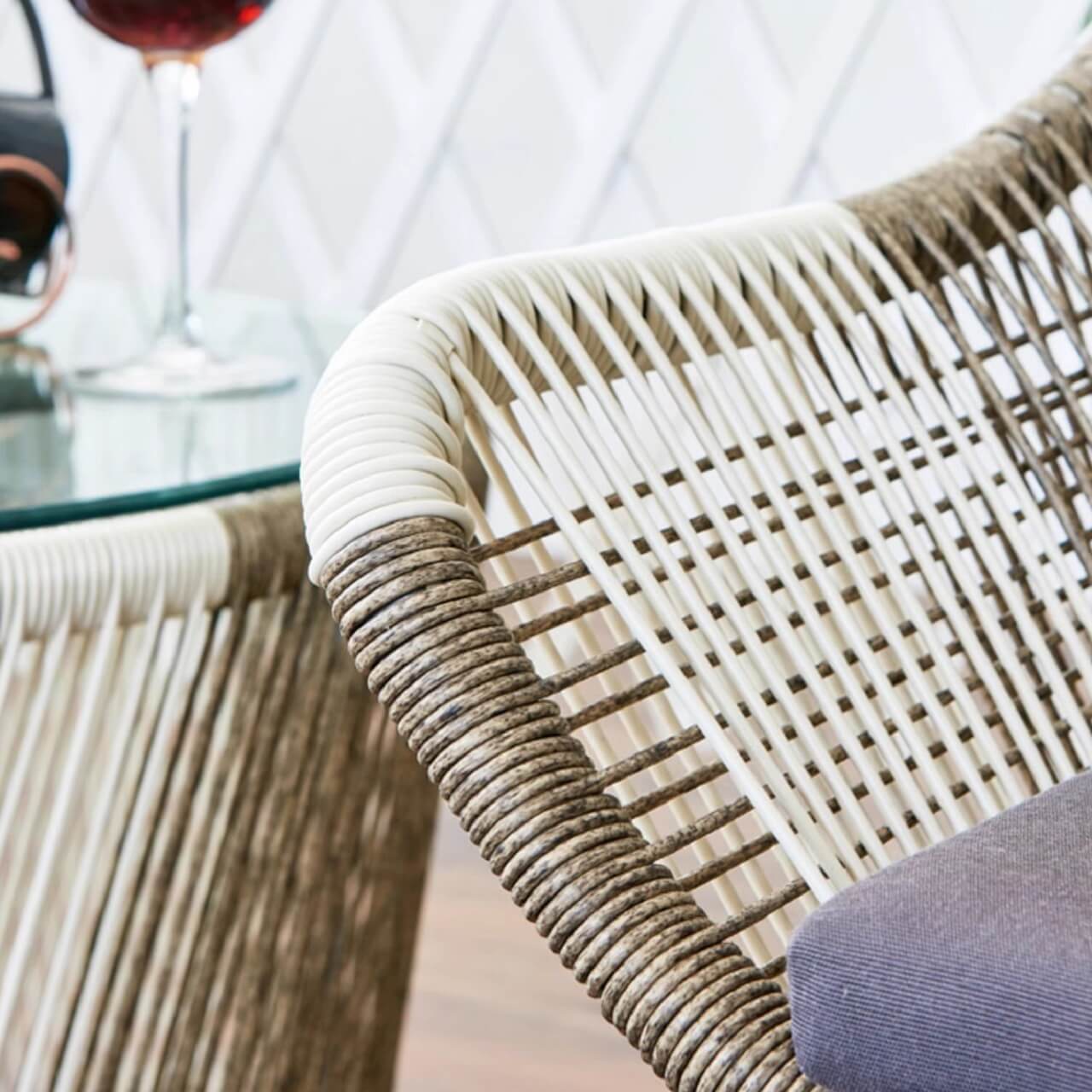 Outdoor PE rattan loveseat with metal legs and cushion pillows for patio seating