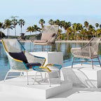 Outdoor PE rattan loveseat with metal legs and cushion pillows for patio seating