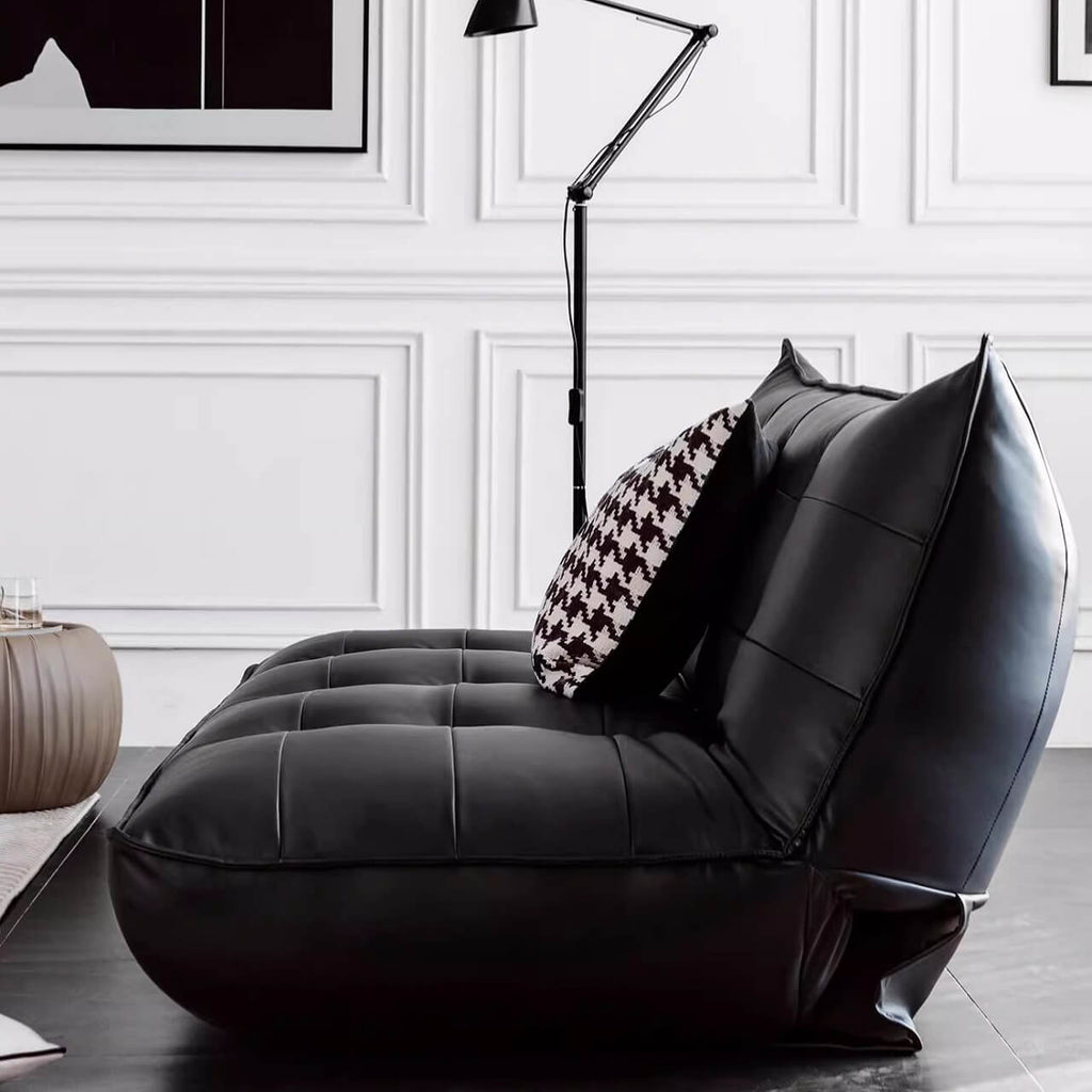 Black retro microfiber leather sofa bed with reclining and armless design for versatile comfort
