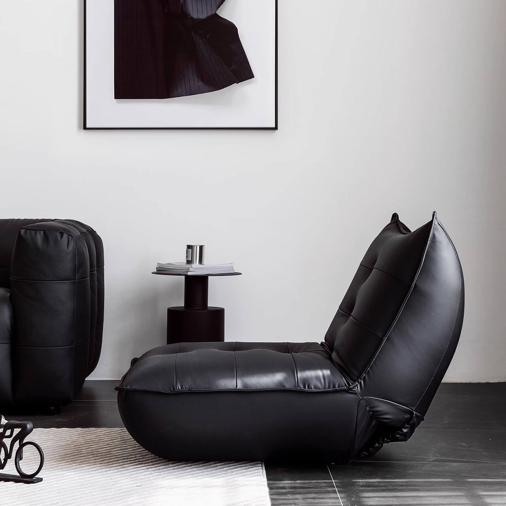 Black retro microfiber leather sofa bed with reclining and armless design for versatile comfort