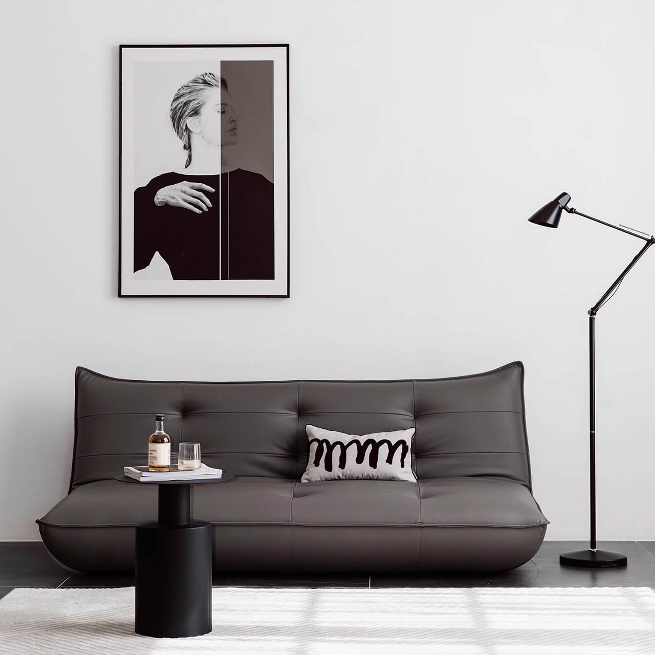 Black retro microfiber leather sofa bed with reclining and armless design for versatile comfort