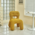 Sculptural Boucle Kids Chair With Rounded Cutout Back and Playful Colors