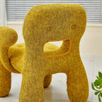Sculptural Boucle Kids Chair With Rounded Cutout Back and Playful Colors