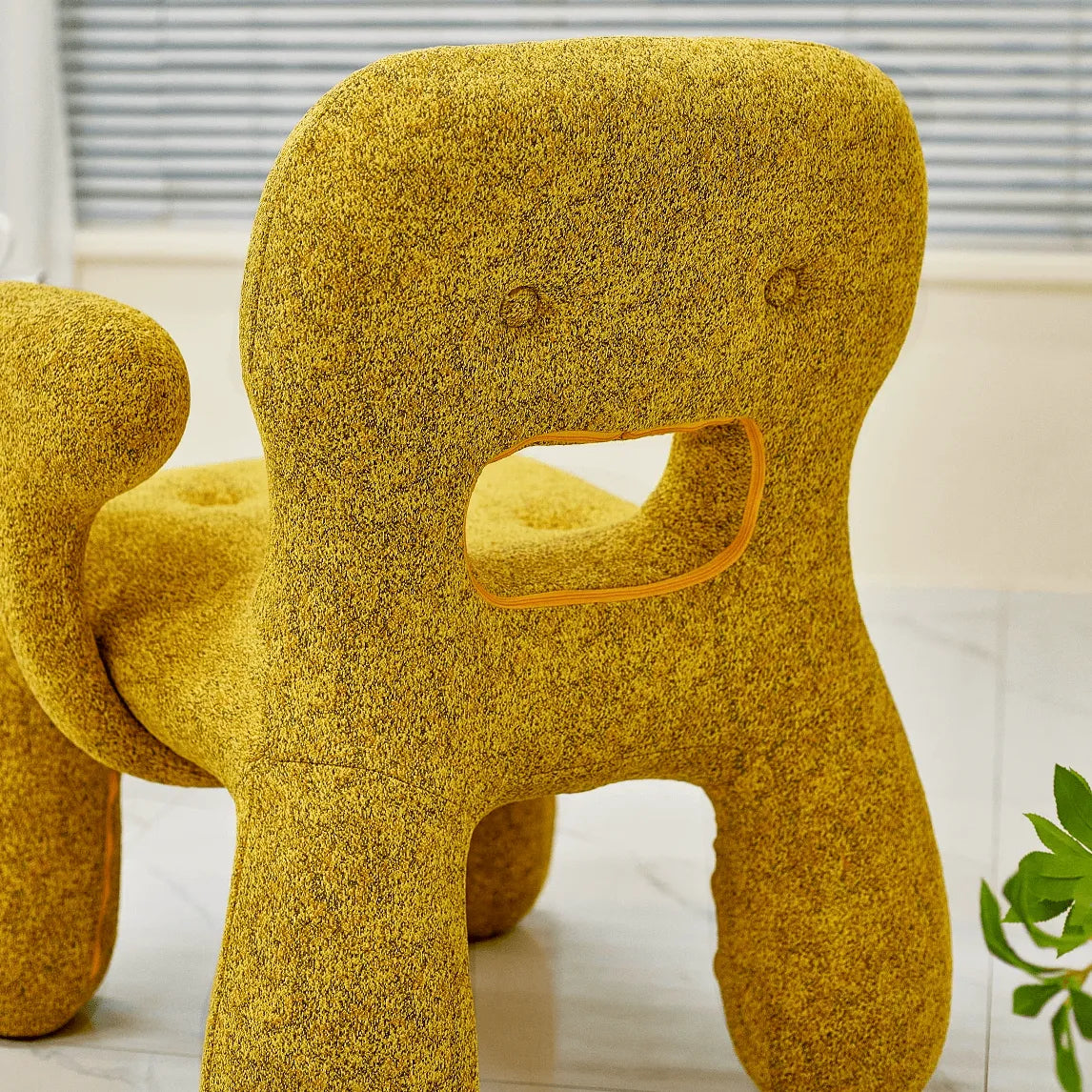 Sculptural Boucle Kids Chair With Rounded Cutout Back and Playful Colors