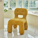 Sculptural Boucle Kids Chair With Rounded Cutout Back and Playful Colors