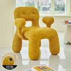 Sculptural Boucle Kids Chair With Rounded Cutout Back and Playful Colors
