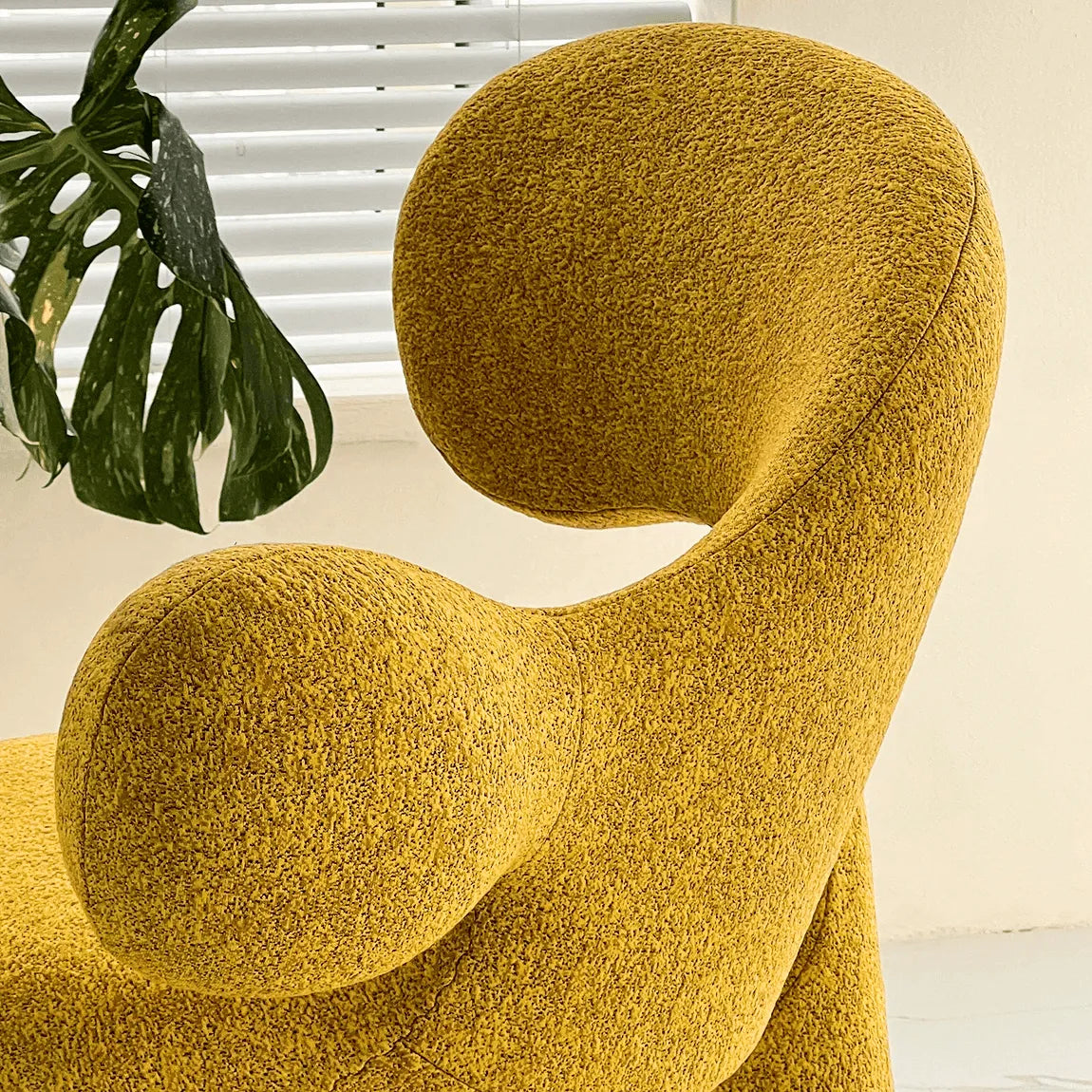 Sculptural Curved Accent Chair with Plush Texture and Bold Colors