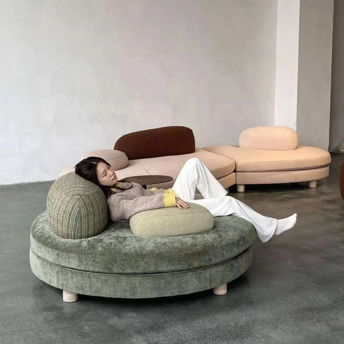 Sculptural Green Round Sofa With Asymmetrical Curve Back for Open Living