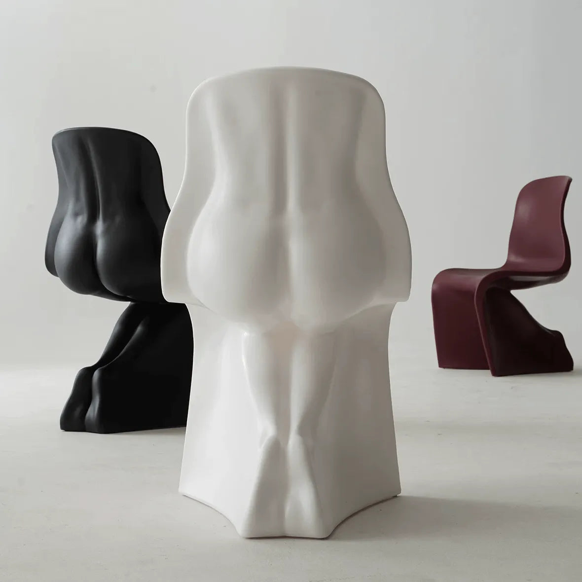 Sculptural Her Chair Dining Chair Series in Glossy Curved Silhouettes