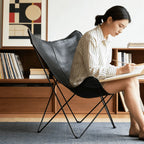 Sculptural Leather Butterfly Chair with Ergonomic Wingback Design