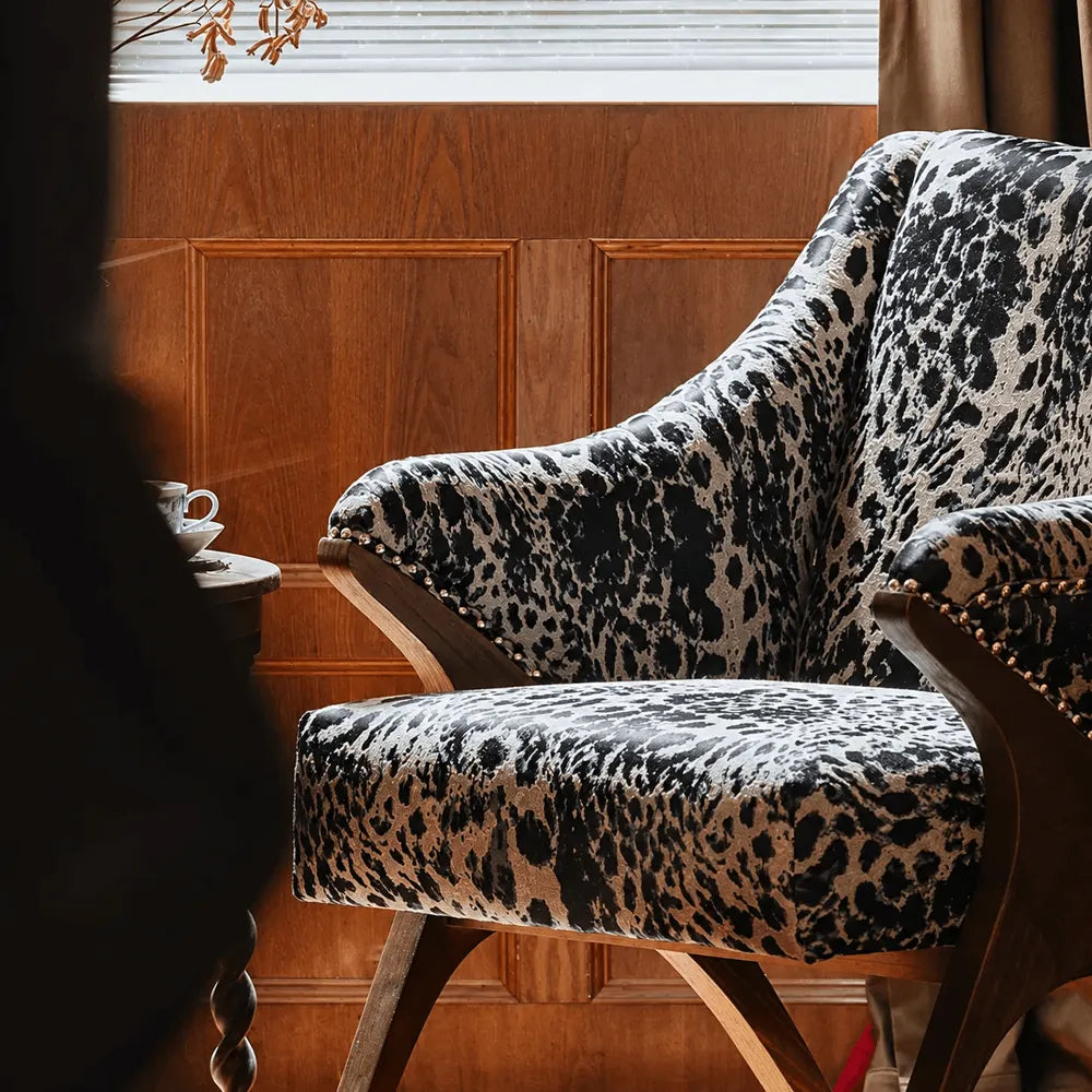 Sculptural Leopard Wingback Chair Series with Exposed Wood Frame and Rich Textures