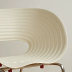 Sculptural Tom Vac Chair With Ribbed Curves and Ergonomic Metal Base