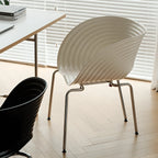 Sculptural Tom Vac Chair With Ribbed Curves and Ergonomic Metal Base