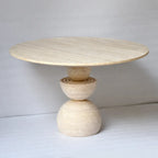 Sculptural Travertine Dining Table With Warm Beige Stone and Pedestal Base