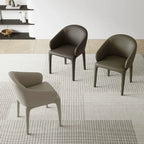 Sculptural Upholstered Dining Chair Series with Curved Arms and Slender Legs