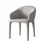 Sculptural Upholstered Dining Chair Series with Curved Arms and Slender Legs