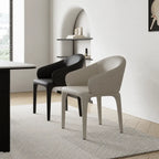 Sculptural Upholstered Dining Chair Series with Curved Arms and Slender Legs