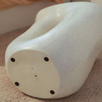 Sculptural White Concrete Side Table with Organic Curves and Elliptical Cutout