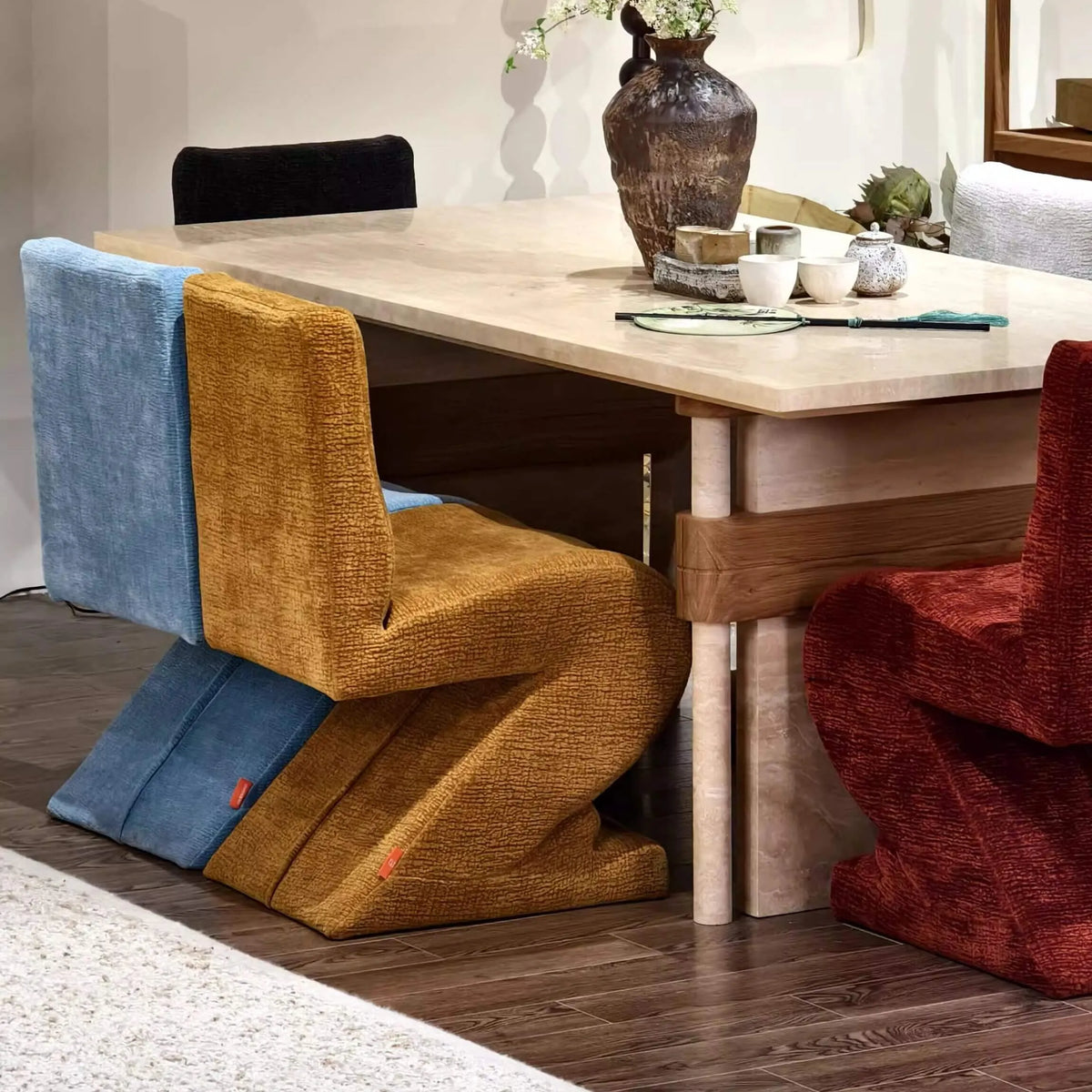 Sculptural Zigzag Chair Series With Zebra Print Textures and Soft Curved Upholstery