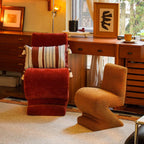 Sculptural Zigzag Chair Series With Zebra Print Textures and Soft Curved Upholstery