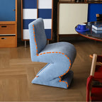 Sculptural Zigzag Chair Series With Zebra Print Textures and Soft Curved Upholstery