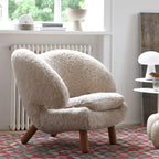 Shearling Pelican Chair Series With Walnut Legs and Embrace Lounge Silhouette