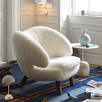 Shearling Pelican Chair Series With Walnut Legs and Embrace Lounge Silhouette