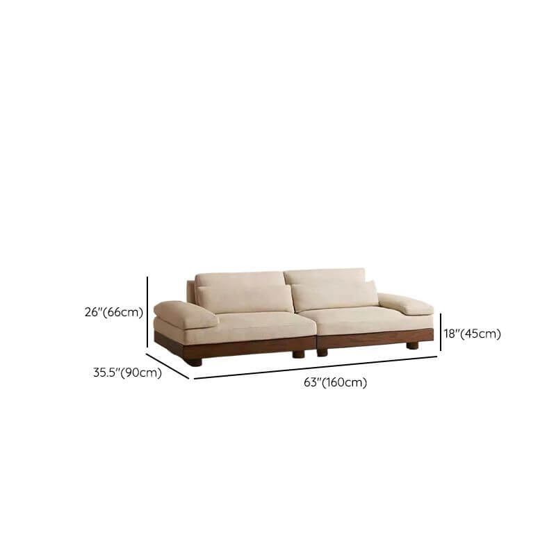 Cream Art Deco floor sofa with pillow back, pillow top arms, slipcover, and multiple pillows for seating 2 to 4 people dimensions