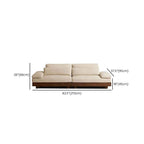 Cream Art Deco floor sofa with pillow back, pillow top arms, slipcover, and multiple pillows for seating 2 to 4 people dimensions