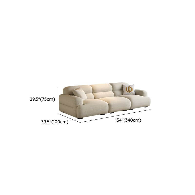 Chic off-white single sofa with biscuit back