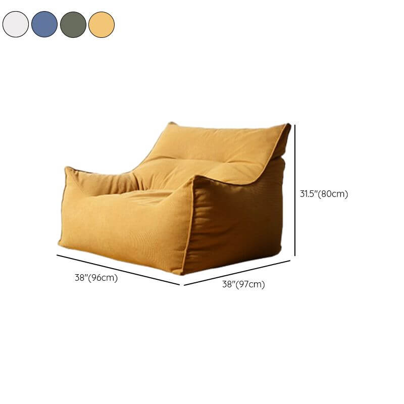 Relaxing setup with yellow bean bag and ottoman