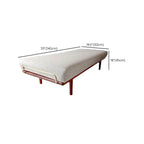 Modern furniture setup including beige ottoman