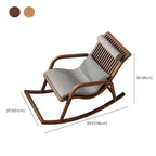 Nut-brown rocking armchair in a cozy living room