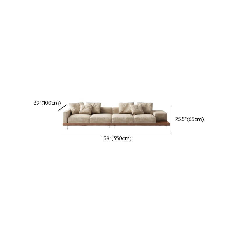 Cream floor sofa with armrest