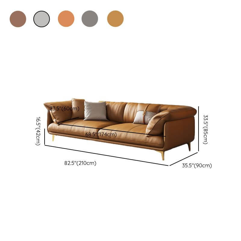 Grey and amber color sofa with pillows