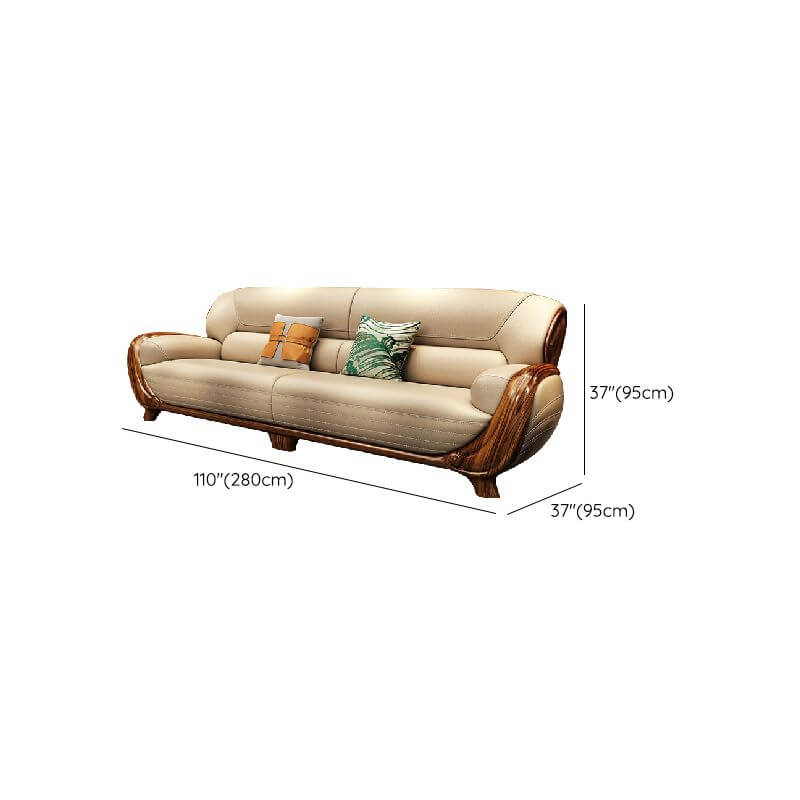 Elegant camel back sofa in living room setting