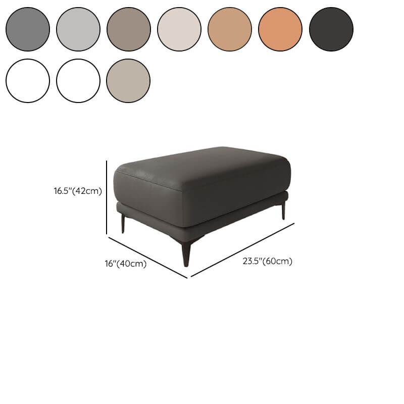 Side view of gray leather ottoman with sponge cushion