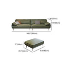 Comfortable pillow back on olive green sofa
